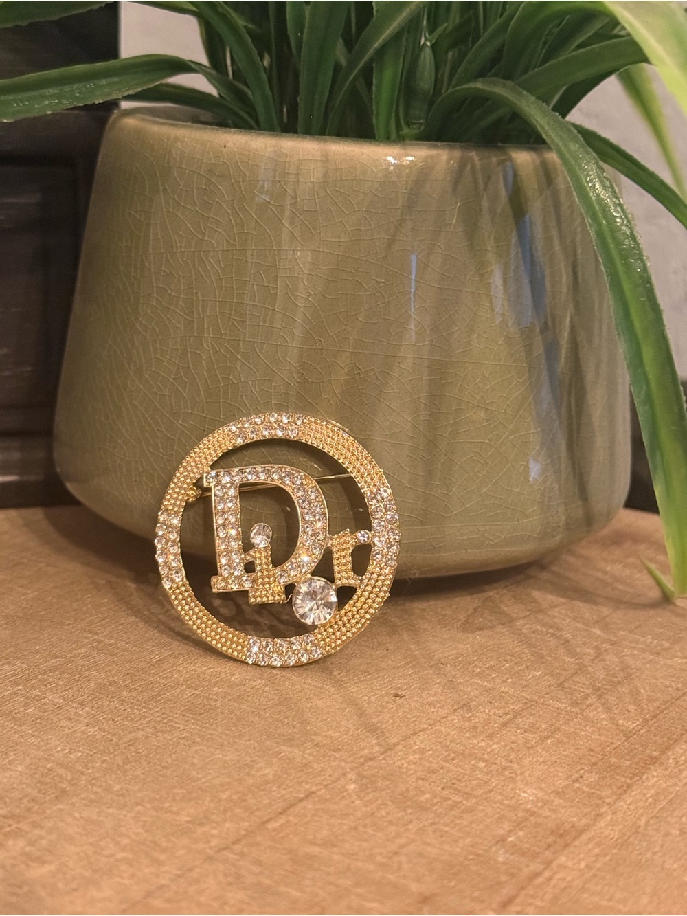 Monogram, gold, crystal brooch